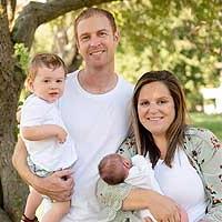 Linsey Baldwin smiling with her family.